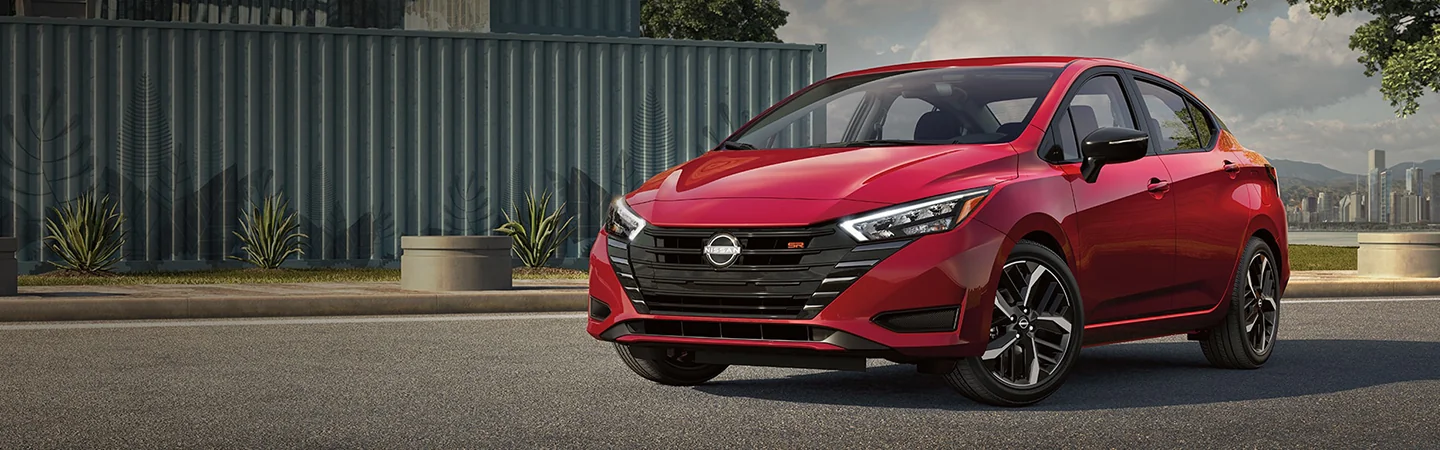 2024 Nissan Versa Specs front sie in red 