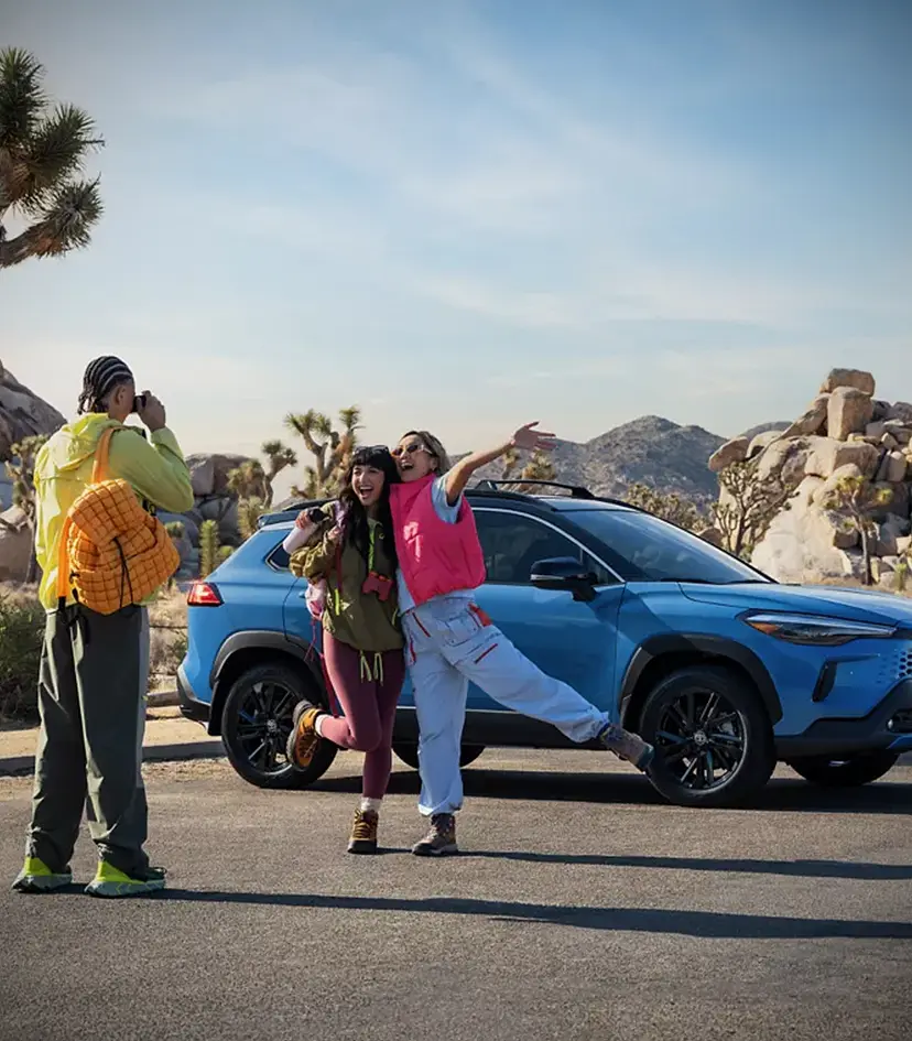 taking picture outside new car