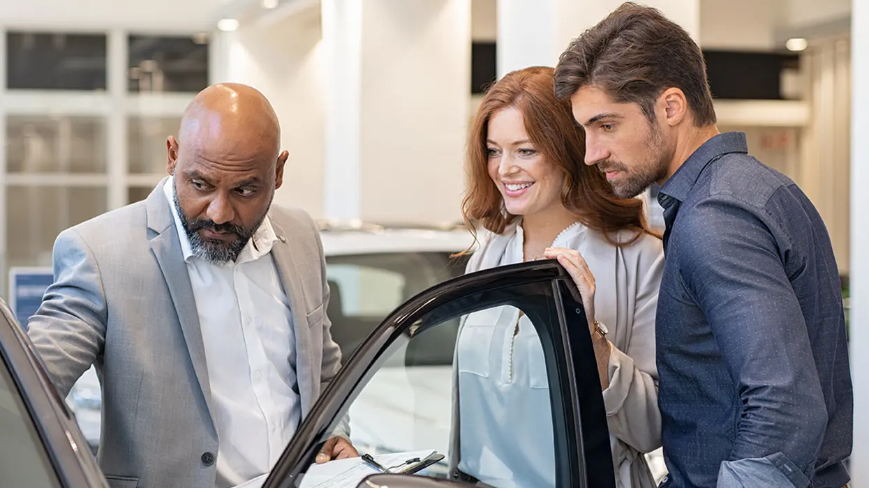 people car shopping in showroom