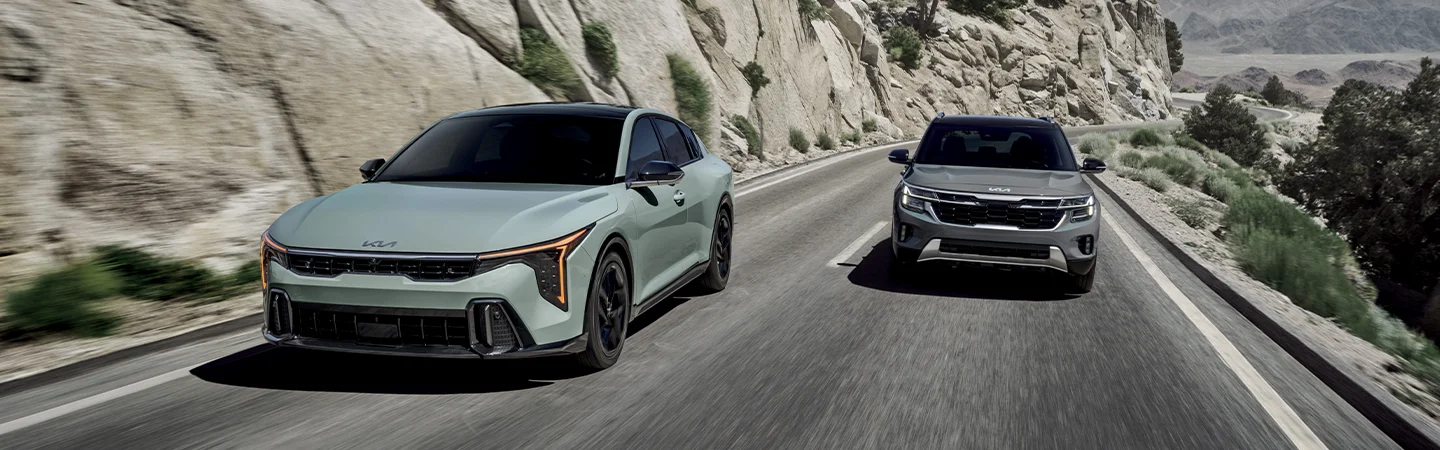 Kia K4 and K5 driving on street