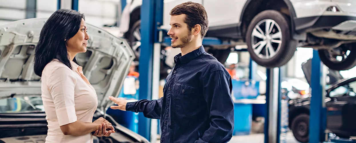 Service mechanic talking to a customer