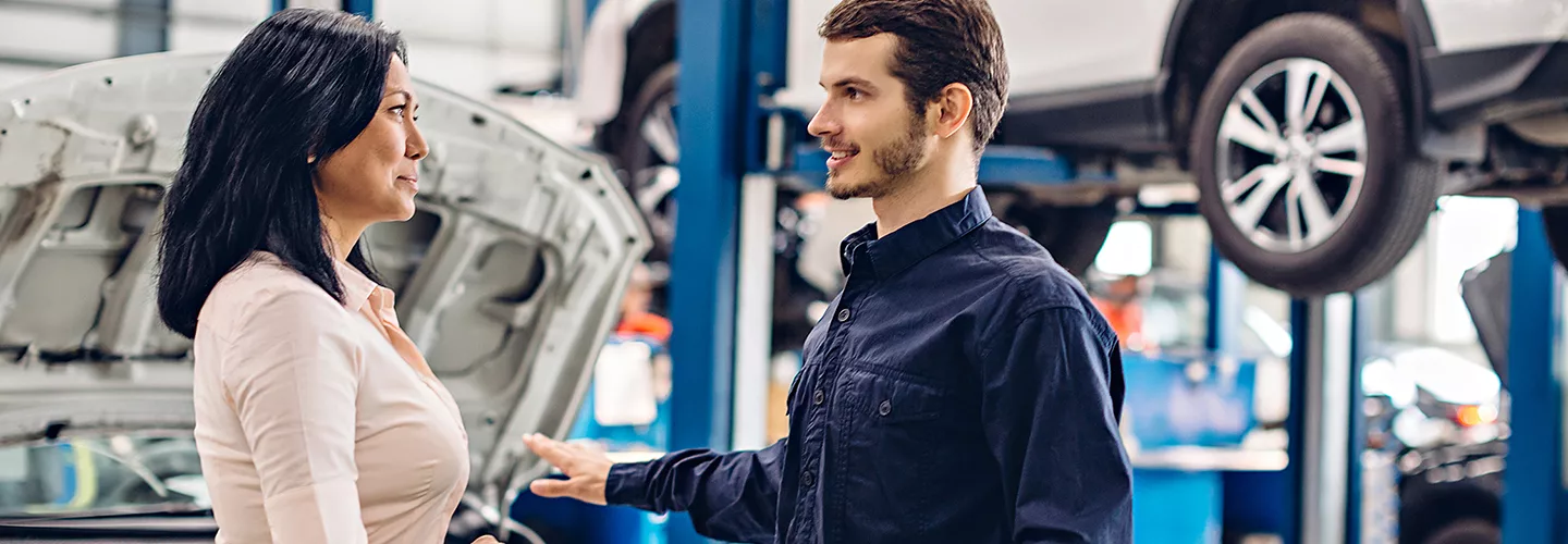 Service mechanic talking to a customer