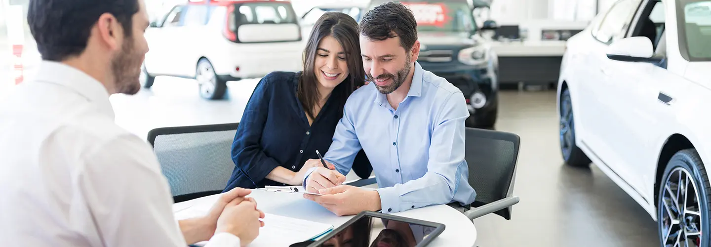 people shopping for a new car at our dealership showroom