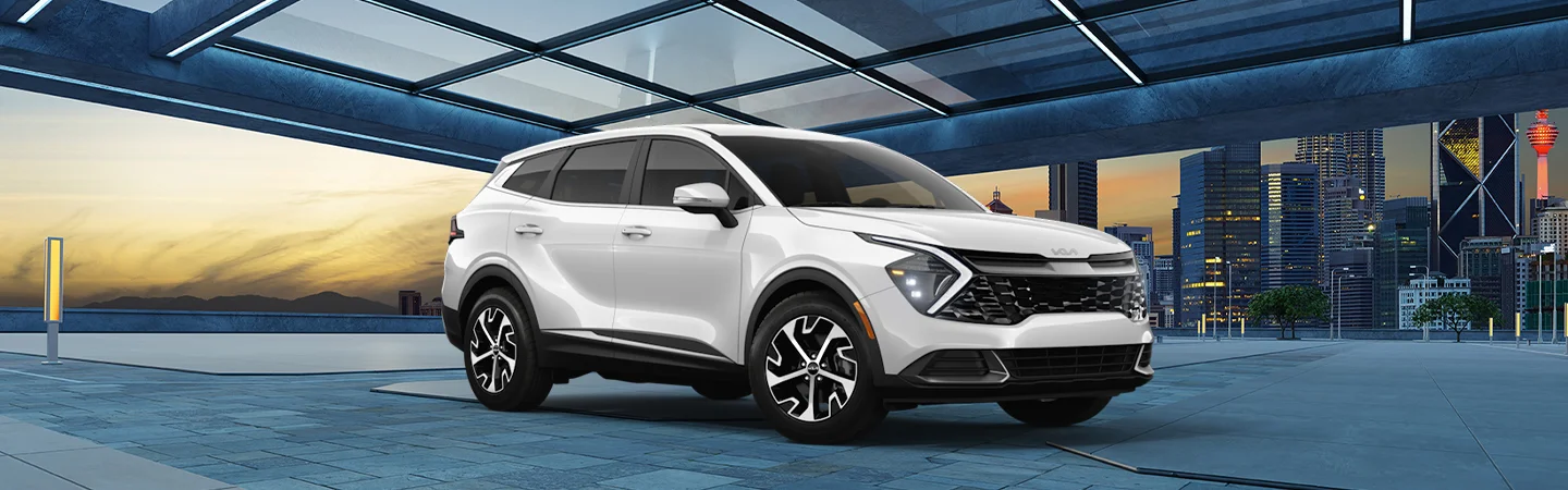 A parked white 2025 Kia Sportage Hybrid with a city in the background