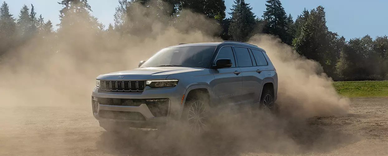 Jeep vehicle driving in a field