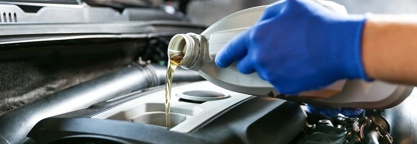 pouring engine oil