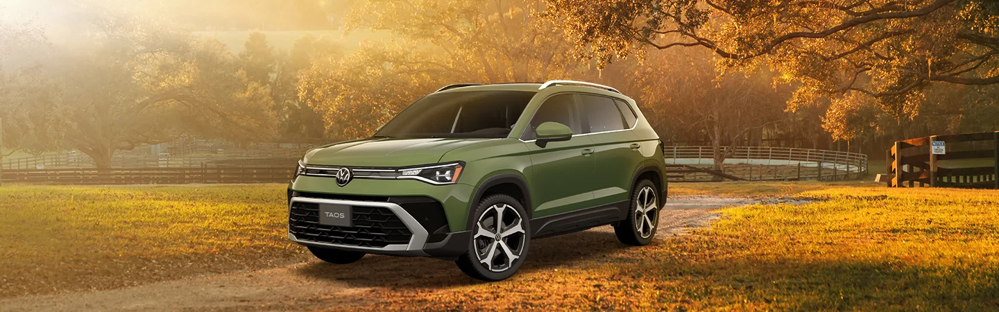 2025 Volkswagen Taos parked on a farm road