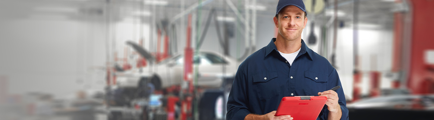 A service technician in a dealership service center