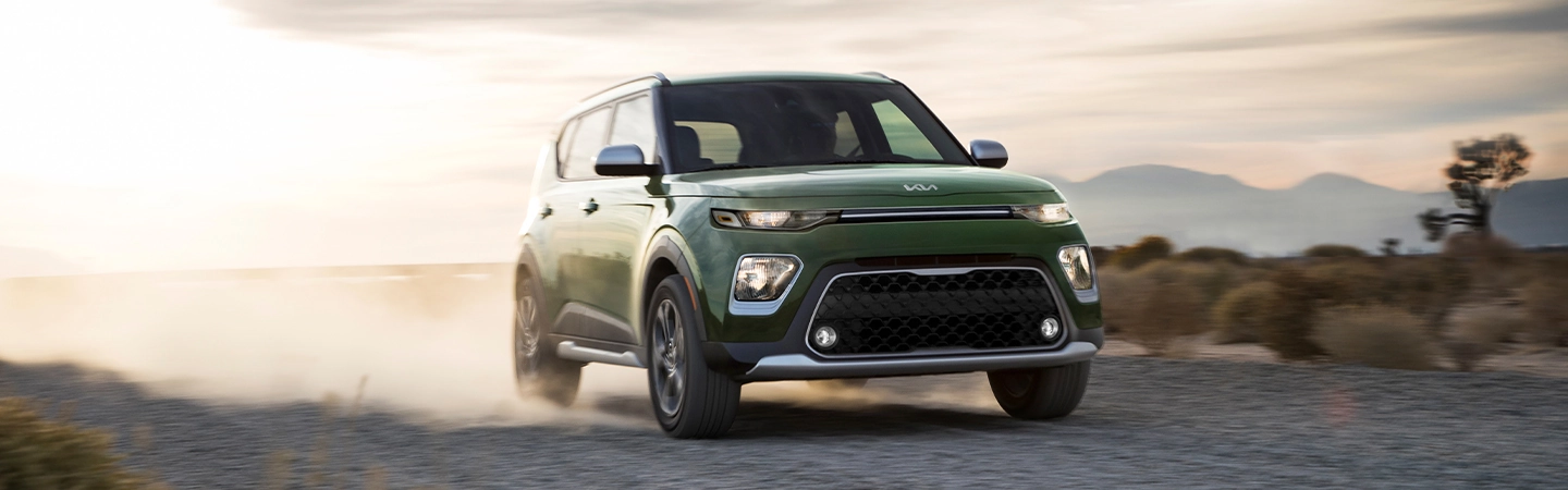 2024 Kia Soul vs Jeep Renegade blue back view