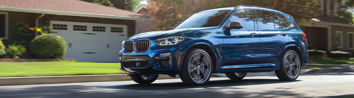 Blue 2020 BMW X3 in motion
