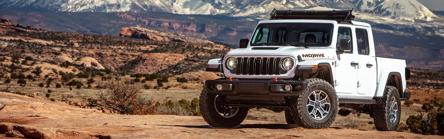 2024 Jeep Gladiator vs Toyota Tacoma silvercolor topview
