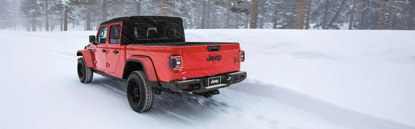2024 Jeep Gladiator vs Toyota Tacoma silvercolor backview