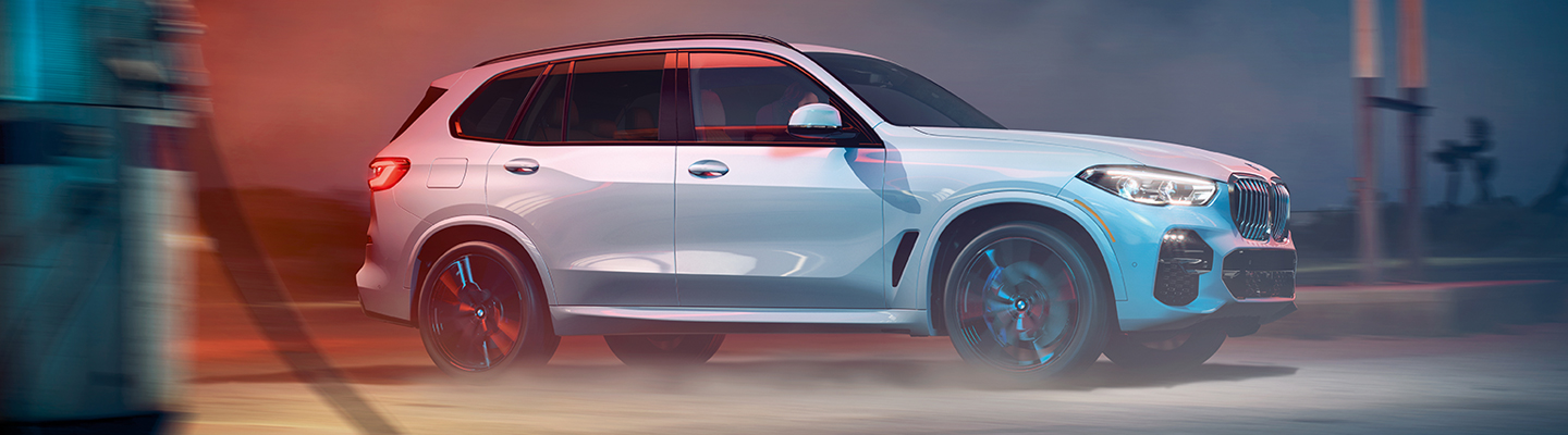  2020 BMW X5 driving next to a beach