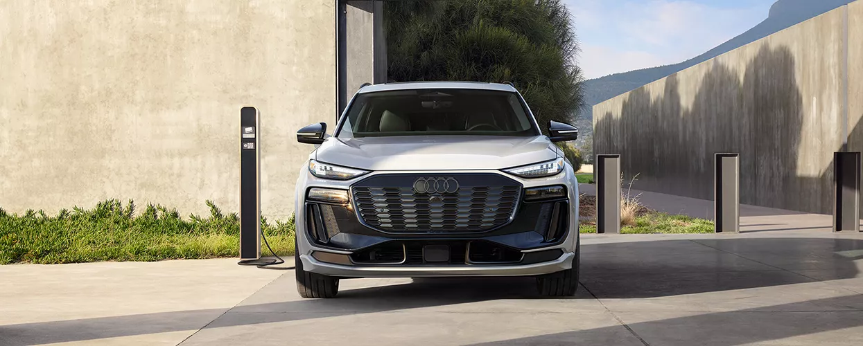 Audi vehicle charging at a charging port