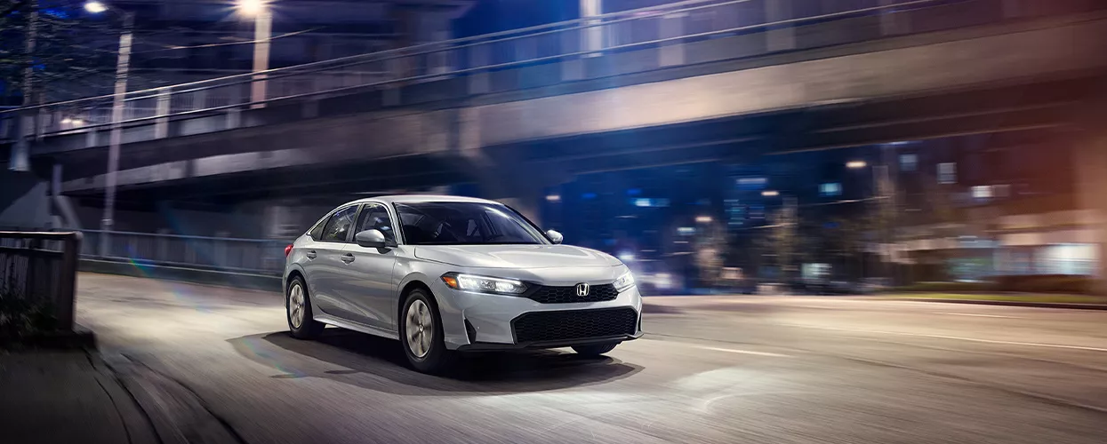2026 Honda Civic driving through a city