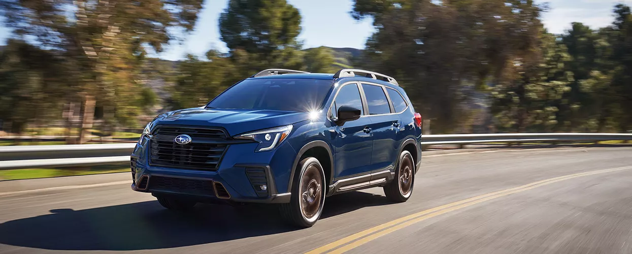 Subaru Ascent driving down a road