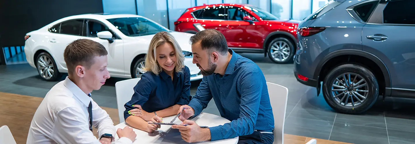 people shopping for a new car at our dealership showroom