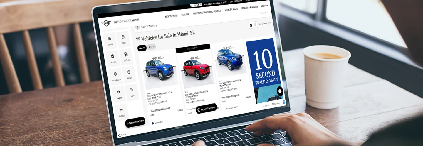 View of laptop that is at dealership website Shopping for a New MINI Online and in Miami, FL