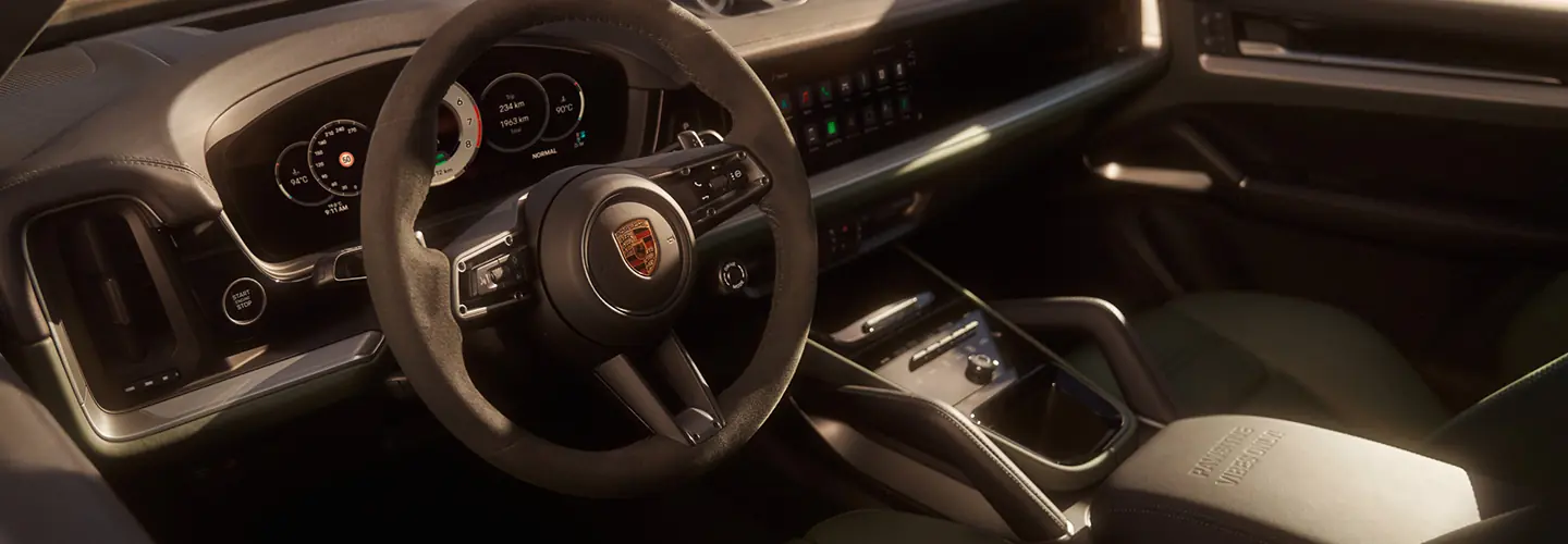 Interior view of the front seat and dashboard of a 2025 Porsche Cayenne