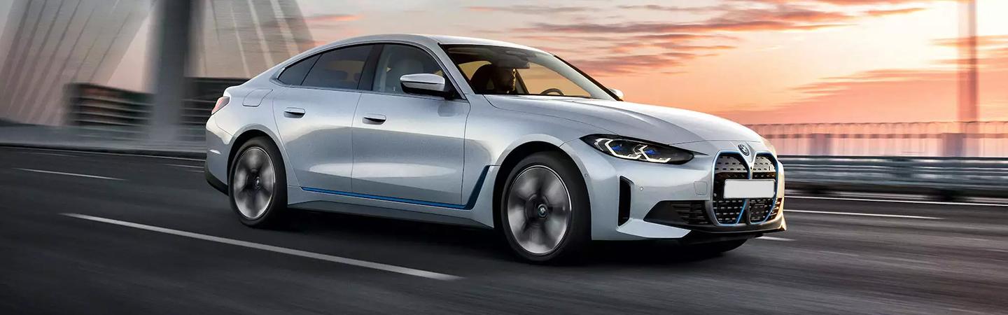 Silver 2022 bmw i4 on city highway