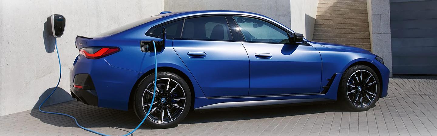 Blue 2022 bmw i4 at charging station