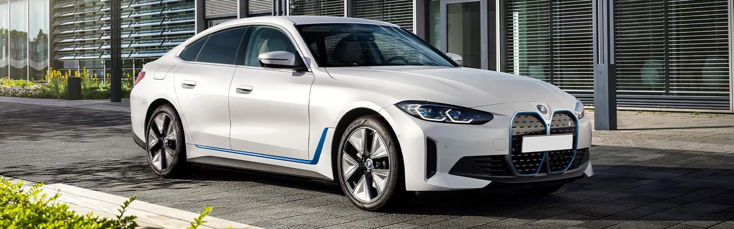 Silver 2022 bmw i4 parked in driveway