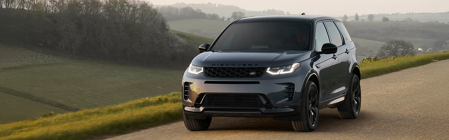 silver 2025 Discovery Sport S in motion on country road