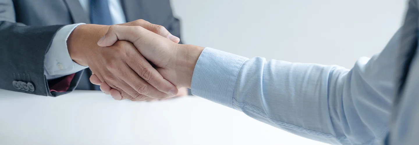 Two people shaking hands