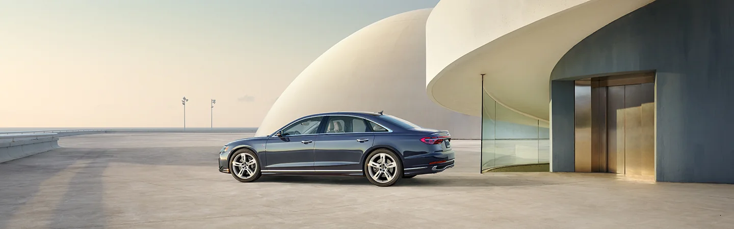 2025 Audi A8 parked by a modern building