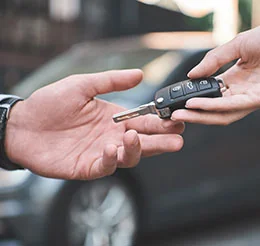Key being handed over with view of the hands only