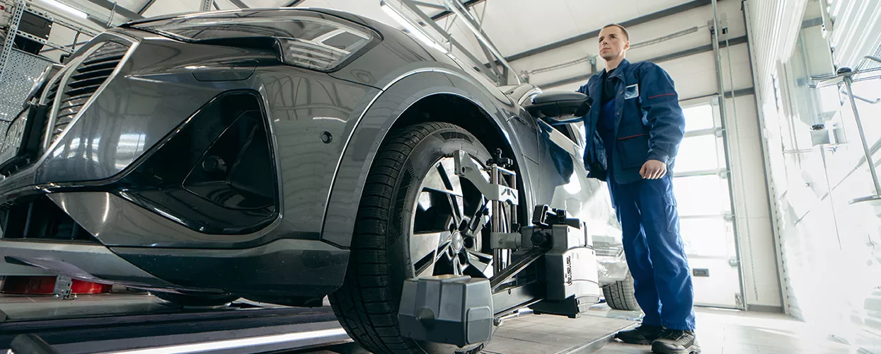 Service mechanic working on a vehicle