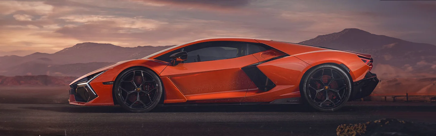 2024 Lamborghini Revuelto vs Urus orange color and side view