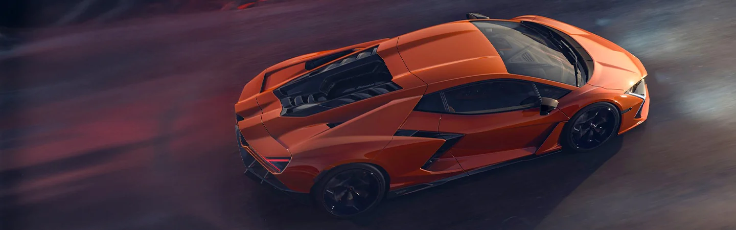 2024 Lamborghini Revuelto vs Urus orange color and side view