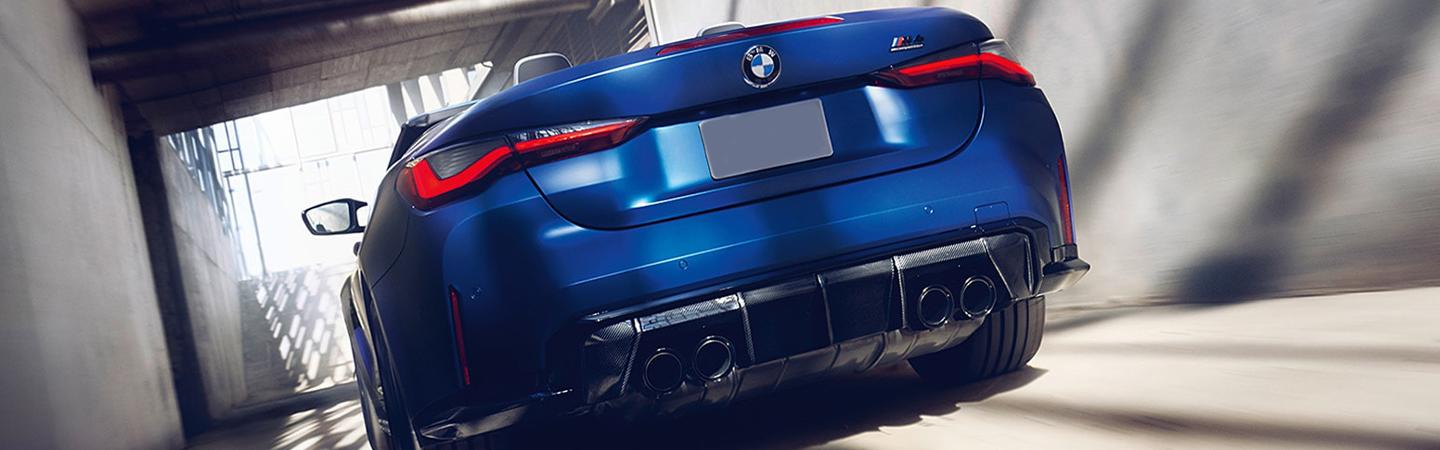 Rear view of blue 2022 BMW M4 Convertible 