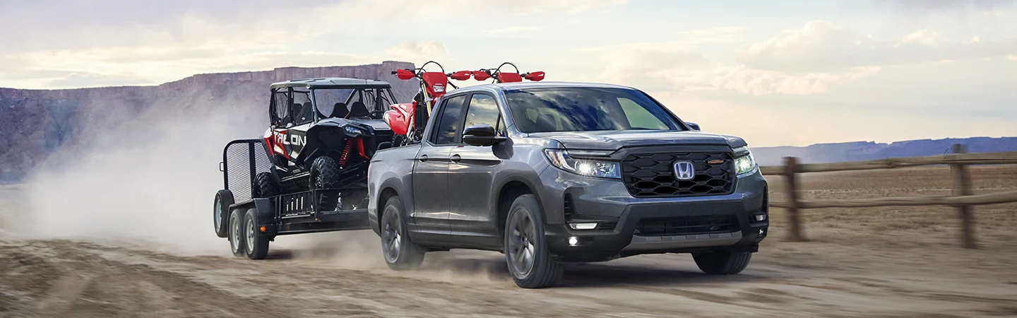 gray Honda truck hauling