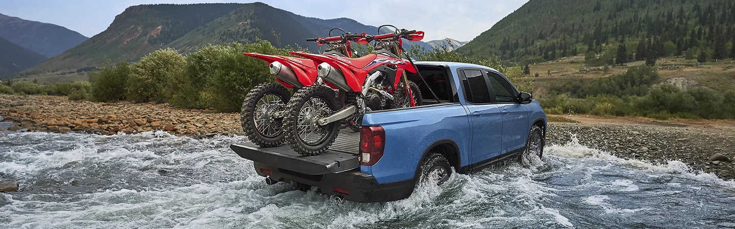 blue Honda over river