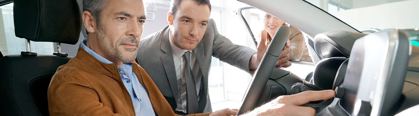 guys in car showroom