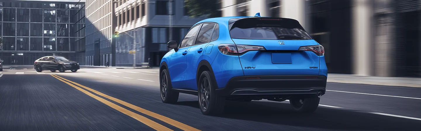 Back view of a 2026 Honda HR-V driving in the city
