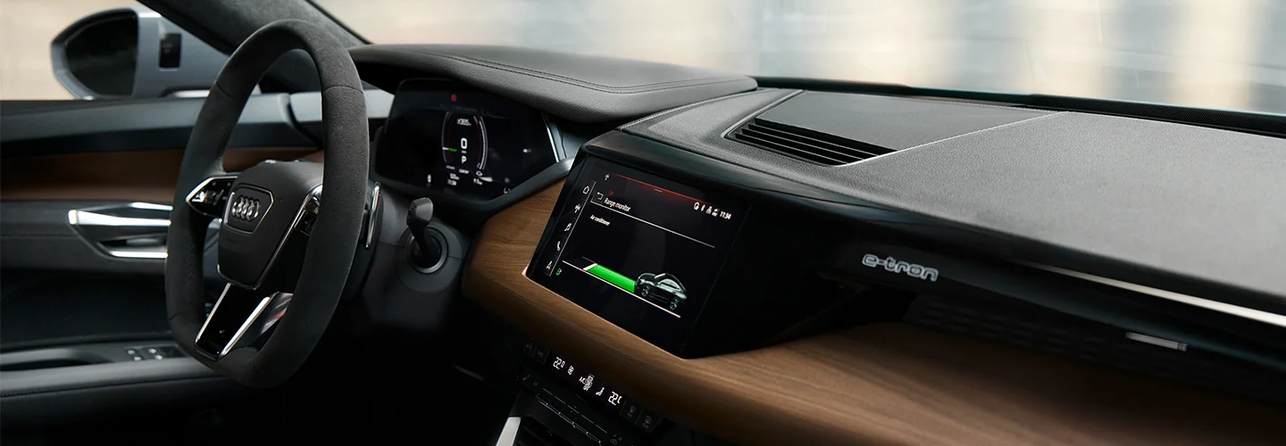 Interior view of the dashboard and tech of a 2024 Audi Q4 e-tron Premium