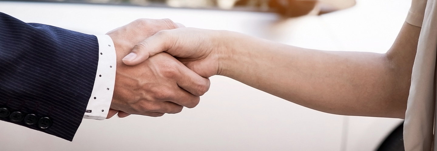 A handshake between two people making a deal