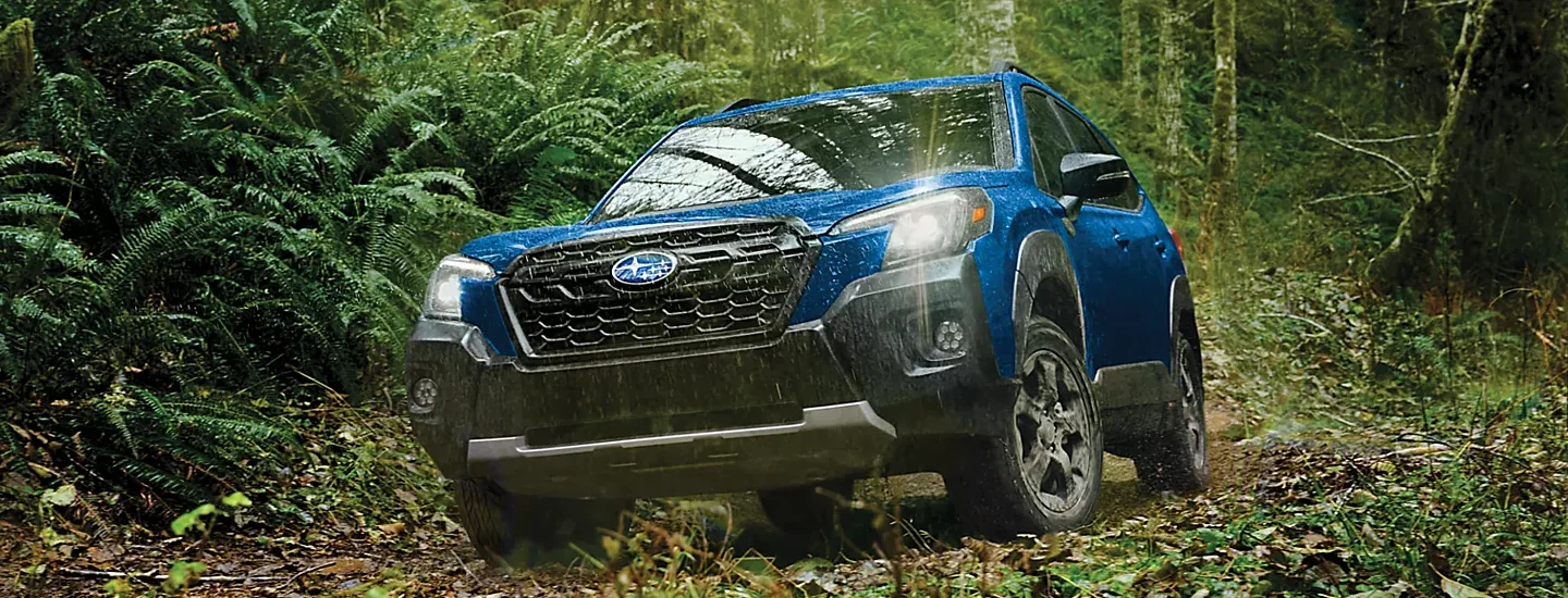 2024 Subaru Forester driving in the Wilderness