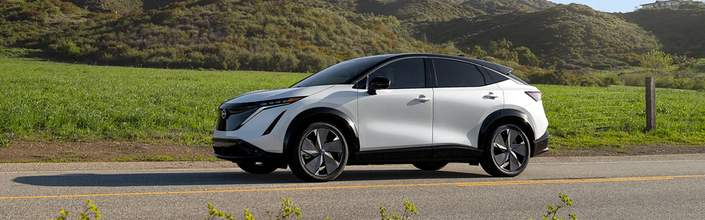 driver side view of a white 2025 Nissan ARIYA ENGAGE