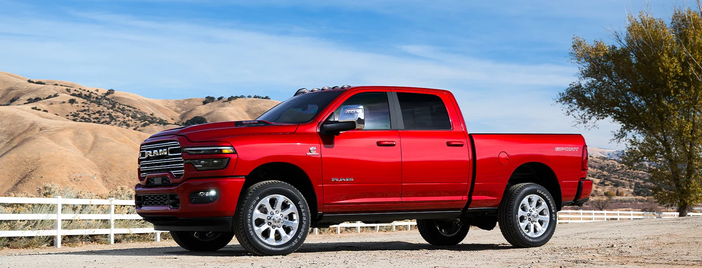 red RAM Truck parked near fence