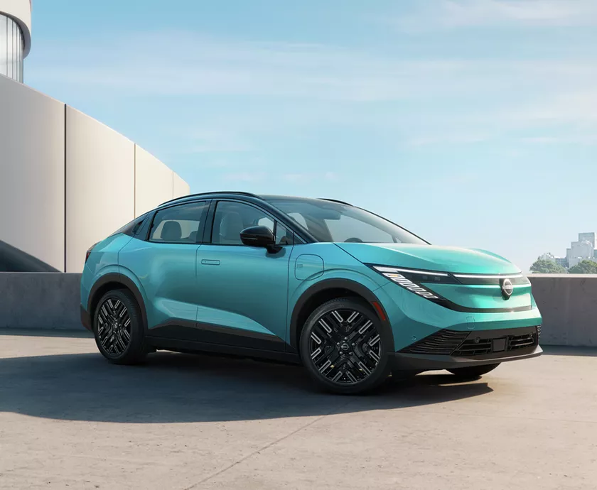 a bright blue green 2026 Nissan LEAF