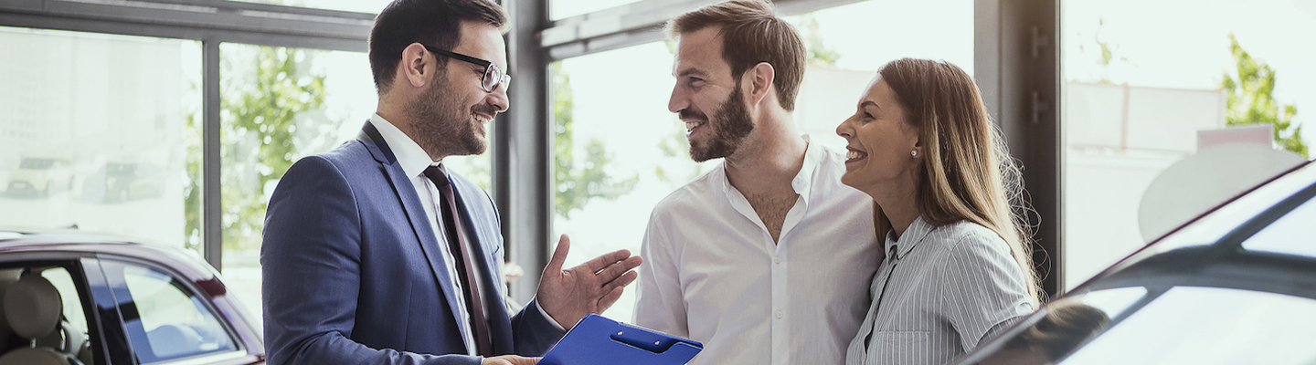 people car shopping in car showroom