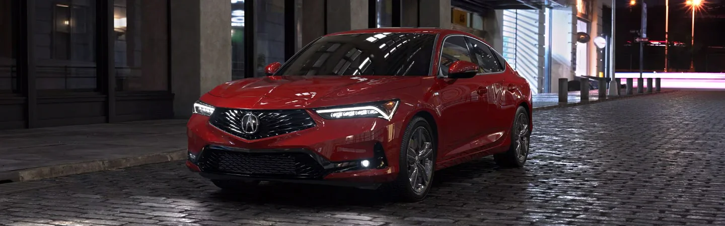 re 2025 Acura Integra parked in city at night