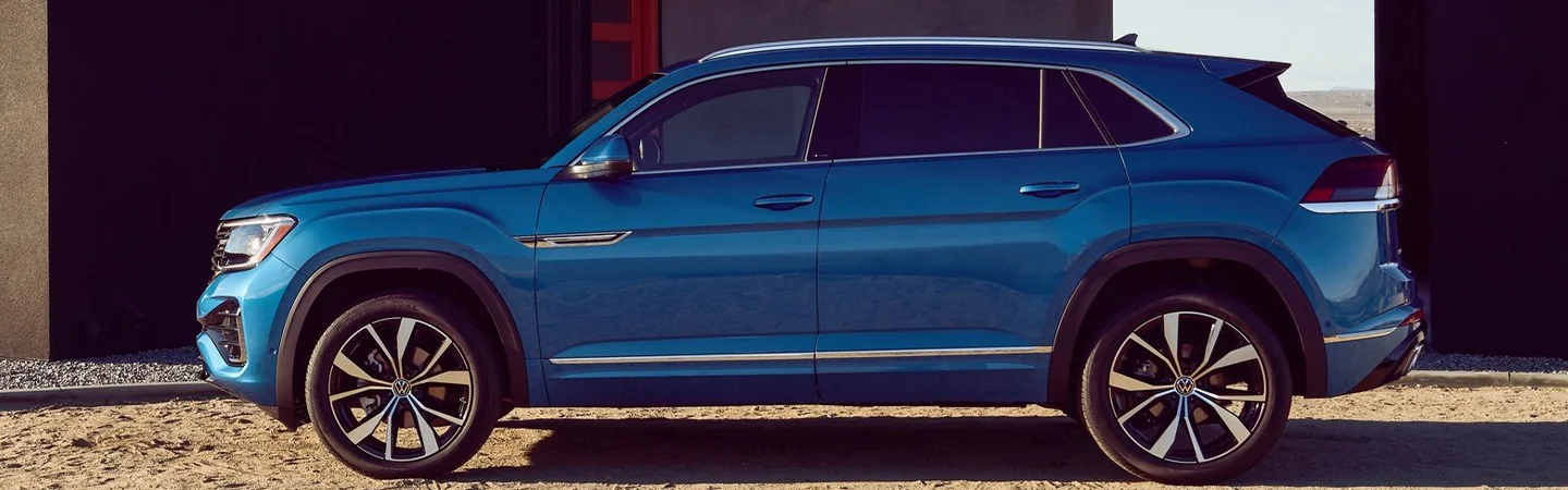 2024 Volkswagen Atlas Cross Sport Specs side front in blue 