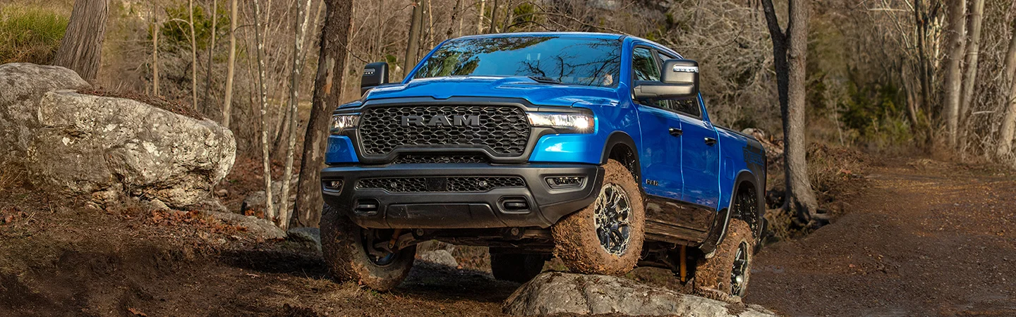 blue 2026 RAM 1500 in muddy scene