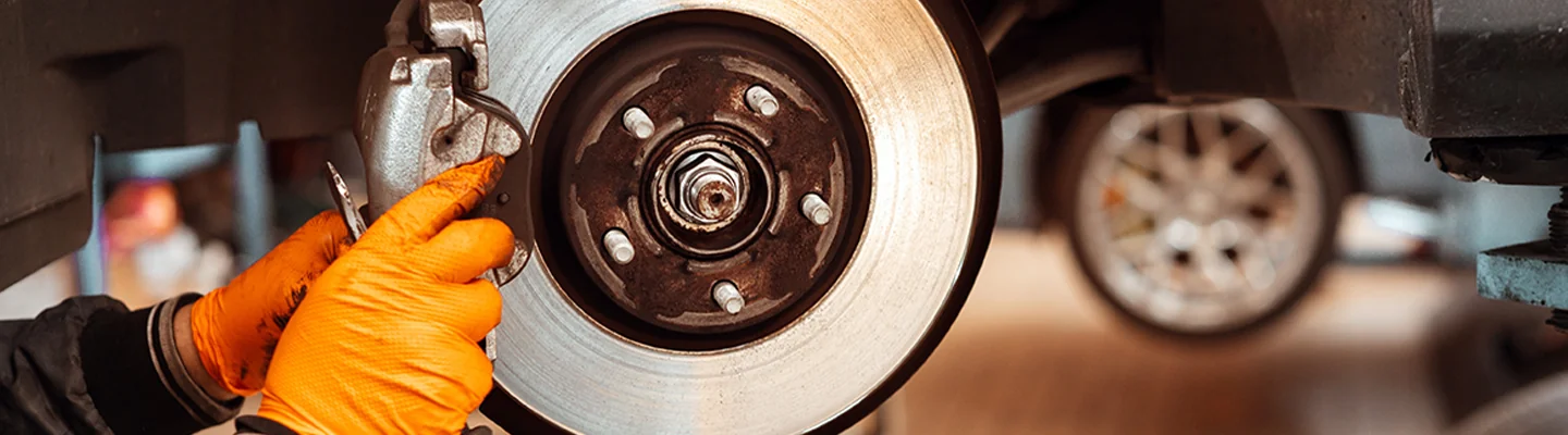 Service tech working on brakes