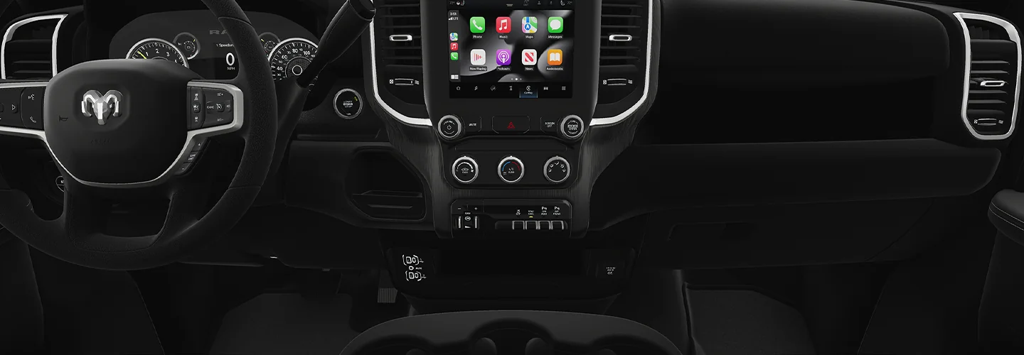Interor view of a the dashboard and tech in a 2025 RAM 2500